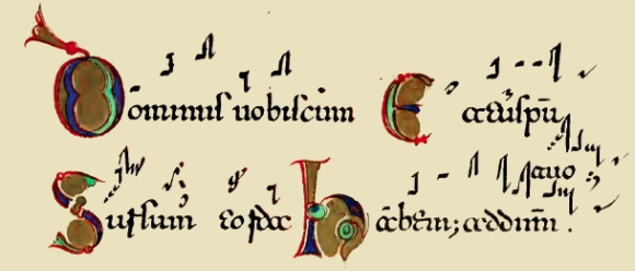 Ecriture lombarde accompagnée de notes de musique.